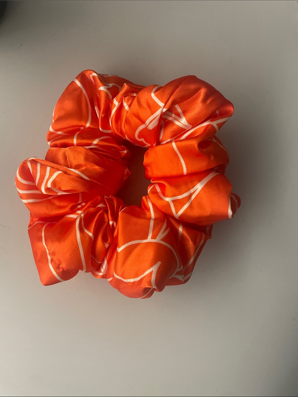 amika Orange Satin Scrunchie with White Line Pattern oversized hair accessory